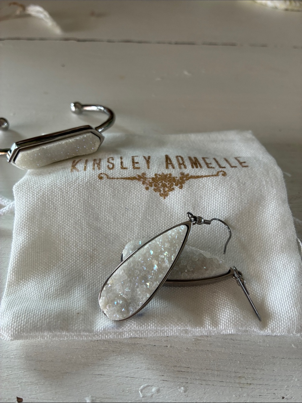 Kinsley Armelle White Druzy Teardrop Earrings and matching silver tone bracelet